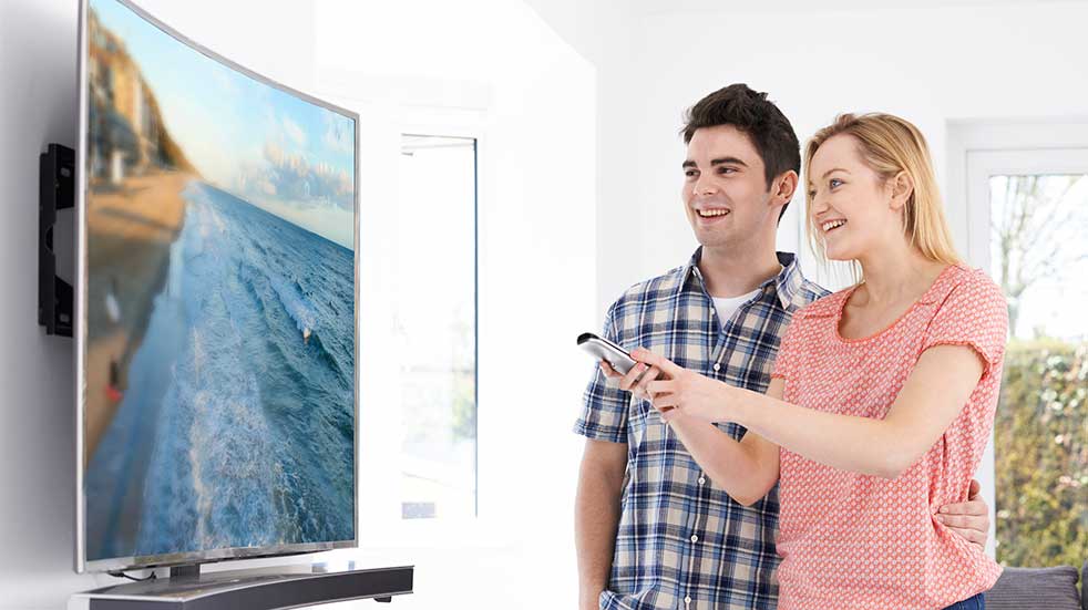 Deals for key workers couple looking at TV